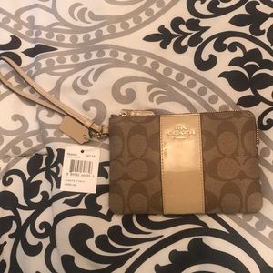 NWT very spacious coach nude and brown wristlet